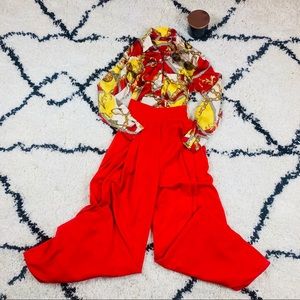 Elegant silk blouse with red wide leg pants